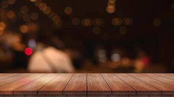 Empty wooden table top with lights bokeh on blur restaurant background. video