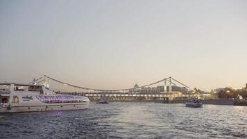 Beautiful long St. Petersburg Neva. Action. The evening river on which ships sail and which is all lit up with lights and bridges are visible. video