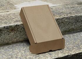 Cardboard boxes on the stairs with texture use for mockup photo
