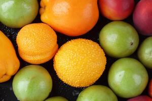 Beautiful Tropical Fruits Background A Luscious Display of Nature's Bounty, Featuring an Abundance of Colorful and Exotic Fruits Against a Vibrant and Refreshing Backdrop photo