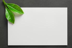 Beautiful Mockup Paper on Wooden Background Combined with Leaves, Creating a Charming and Natural Setting for Creative Designs and Artistic Presentations photo