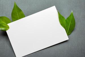 Beautiful Mockup Paper on Wooden Background Combined with Leaves, Creating a Charming and Natural Setting for Creative Designs and Artistic Presentations photo