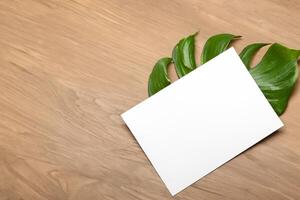 Wooden Background Combined with Leaves Enhances the Elegance of Paper, Creating a Stunning Composition Inspired by Nature's Harmony photo