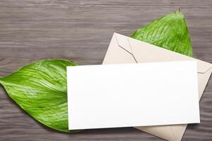 Wooden Background Combined with Leaves Enhances the Elegance of Paper, Creating a Stunning Composition Inspired by Nature's Harmony photo