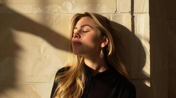 Woman Standing in Front of Wall With Eyes Closed photo