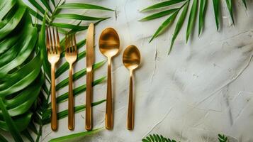 Set of Four Gold Colored Forks and Spoons photo