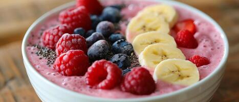 Bowl of Fruit and Yogurt With Bananas and Raspberries photo