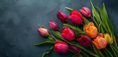 Bouquet of Red and Yellow Tulips on Blue Background photo