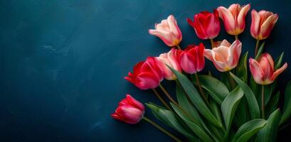 Bouquet of Red and Yellow Tulips on Blue Background photo