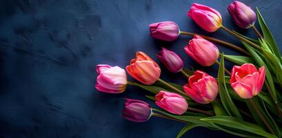 Bouquet of Red and Yellow Tulips on Blue Background photo