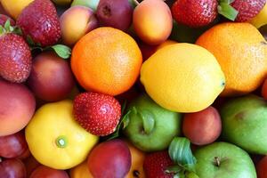 Beautiful Tropical Fruits Background A Luscious Display of Nature's Bounty, Featuring an Abundance of Colorful and Exotic Fruits Against a Vibrant and Refreshing Backdrop photo