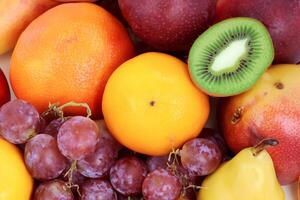 Beautiful Tropical Fruits Background A Luscious Display of Nature's Bounty, Featuring an Abundance of Colorful and Exotic Fruits Against a Vibrant and Refreshing Backdrop photo
