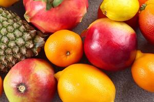 Beautiful Tropical Fruits Background A Luscious Display of Nature's Bounty, Featuring an Abundance of Colorful and Exotic Fruits Against a Vibrant and Refreshing Backdrop photo