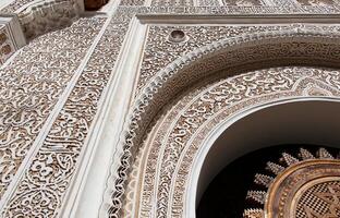 Ornate stucco work, the grandeur of Moroccan craftsmanship in Marrakech. Morocco, Africa. photo