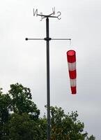 Windsock pointing the wind indicating wind strength and direction. photo