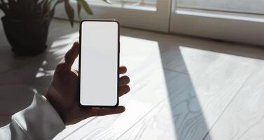 Phone Mockup in Man's Hand in Minimalistic Design. photo