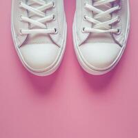 White Sneakers on Pink Background photo