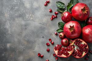 Group of Red Pomegranates With Green Leaves photo