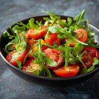 Black Bowl Filled With Salad on Table photo