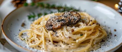 Plate of Pasta With Mushrooms and Parmesan Cheese photo