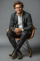 Man in Suit Sitting on Chair photo