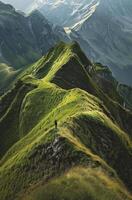 Person Standing on Top of Green Mountain photo