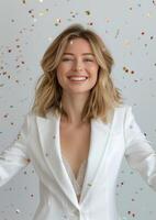 Woman in White Suit and Confetti photo