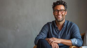 Man Sitting in Chair With Crossed Legs photo