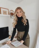 Woman Standing in Front of Laptop Computer photo