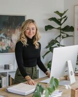 Woman Standing in Front of Laptop Computer photo
