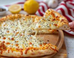 Close Up of Pizza on Cutting Board photo