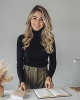 Woman Standing in Front of Desk With Open Book photo