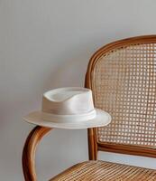 White Hat on Wooden Chair photo