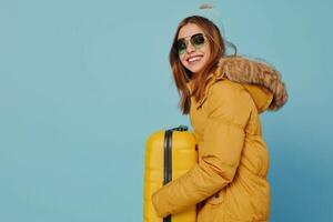 Woman Holding Yellow Suitcase photo