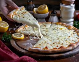 Cheese Being Lifted From Pizza Pan photo