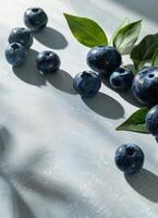 White Bowl Filled With Blueberries on Table photo