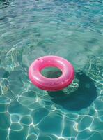 Pink Ring Floating on Water photo