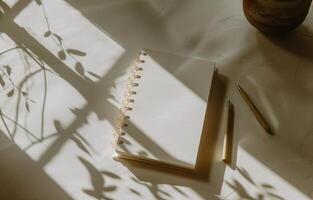 Notepad, Pencil, and Pen on Table photo