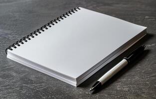 Notebook and Pen on Desk photo