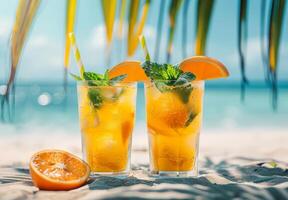 Two Glasses of Iced Tea With Orange Slices and Mint photo