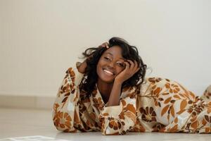 Woman Laying on Floor With Hand on Head photo