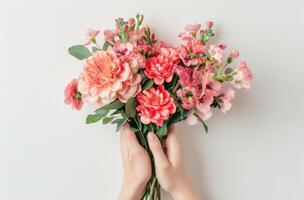 Person Holding a Bunch of Flowers photo