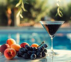 Glass of Wine Next to Bunch of Fruit photo