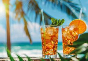 Two Glasses of Iced Tea With Orange Slices and Mint photo