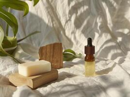 Essential Oil Bottle Next to Soap Block photo