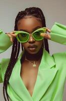 Woman Wearing Neon Green Sunglasses and Green Jacket photo