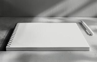 Notebook and Pen on Desk photo