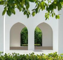 Couple of Archways With Trees in the Background photo