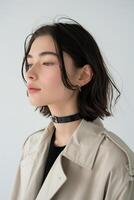 Woman Wearing Trench Coat and Choker photo