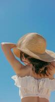 Woman in Bikini and Hat on Beach photo